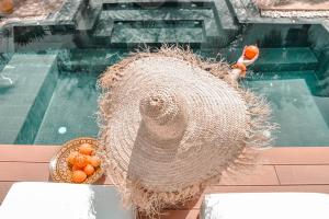 a bird net with a basket of oranges on a table at Riad Mayfez Suites & Spa in Fès