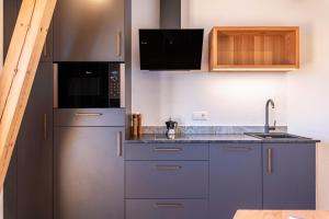 A kitchen or kitchenette at Aschnerhof Holzherz