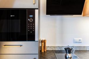 A kitchen or kitchenette at Aschnerhof Holzherz