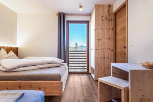 A bed or beds in a room at Aschnerhof Holzherz