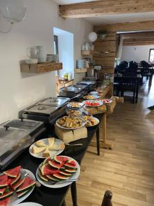 a buffet line with many plates of food at Penzion Lenora in Lenora