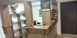 a room with a book shelf with wine glasses at CASA DE VACANTA CLARA MARIA in Comarnic