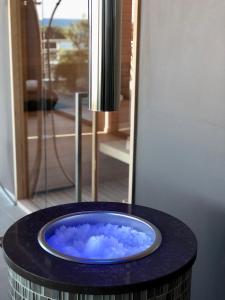 a blue bath tub sitting on top of a table at Corallo Wellness Hotel in Diano Marina