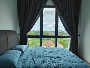 Postel nebo postele na pokoji v ubytování Kuching Holiday onehomestay + 27 fotografií