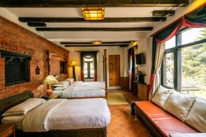 Postel nebo postele na pokoji v ubytování Hotel Ganesh Himal + 37 fotografií