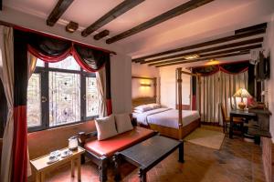 Tempat tidur dalam kamar di Hotel Ganesh Himal