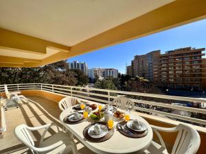 a table and chairs on a balcony with a view at Vilamoura Marina Mar 2 With Pool by Homing in Vilamoura