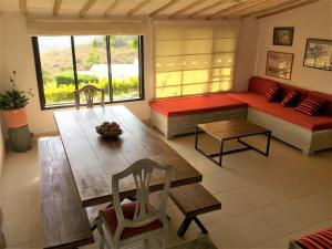 a living room with a couch and a table at Casas La Colina in Curití