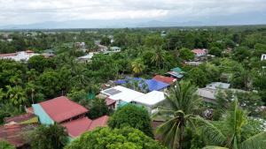 an aerial view of a village with trees and buildings at Sandy Home in Baler