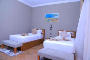 Postel nebo postele na pokoji v ubytování Haile Resort Adama