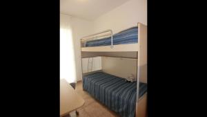 A bed or beds in a room at Homely flat with private garden and common pool
