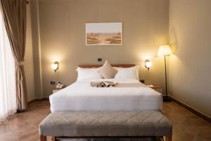 Postel nebo postele na pokoji v ubytování Haile Resort Adama