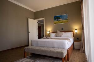 Postel nebo postele na pokoji v ubytování Haile Resort Adama