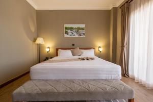 Postel nebo postele na pokoji v ubytování Haile Resort Adama