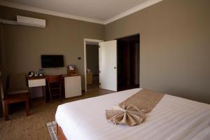 Postel nebo postele na pokoji v ubytování Haile Resort Adama