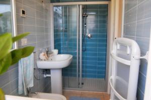 A bathroom at Relaxing apartment in a village with swimming pool