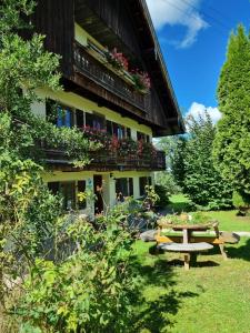 a building with a picnic table in front of it at Holzer-Hof 