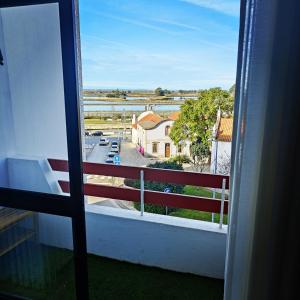 a balcony with a view of a parking lot at Hostel Aveiro in Aveiro