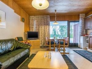 a living room with a couch and a table at Holiday Home Joutiainen l 69 in Hara
