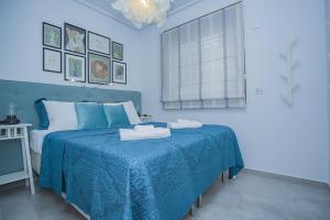 a blue bedroom with a bed with a blue blanket at 240 Lux Pool Home -Alicante Holiday in Torre de la Horadada +37 photos