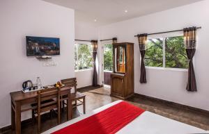 TV a/nebo společenská místnost v ubytování Spice Jungle Resort
