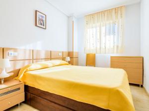 A bed or beds in a room at Apartment Jardin by Interhome