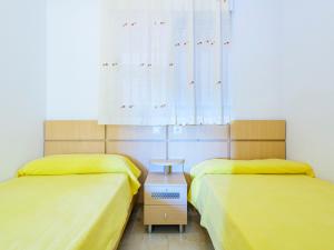 A bed or beds in a room at Apartment Jardin by Interhome