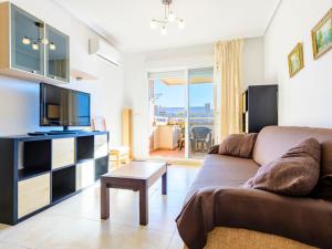 A television and/or entertainment centre at Apartment Jardin by Interhome