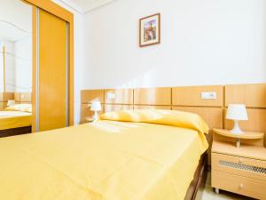 A bed or beds in a room at Apartment Jardin by Interhome