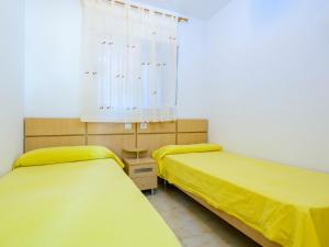 A bed or beds in a room at Apartment Jardin by Interhome