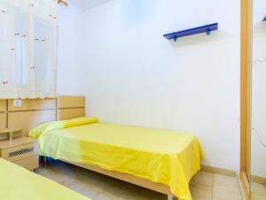 A bed or beds in a room at Apartment Jardin by Interhome