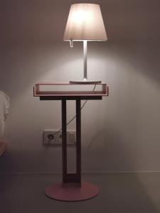 a table with a lamp on top of it at Bretzenstudios in Hall in Tirol