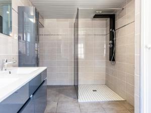 a bathroom with a shower and a sink at Holiday Home Le Coquelicot by Interhome in Pirou