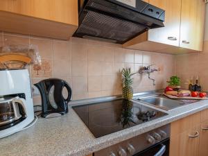 a kitchen with a sink and a counter top at Holiday Home Siggi by Interhome in Norddeich