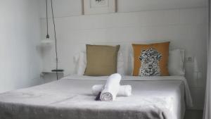 Posteľ alebo postele v izbe v ubytovaní Hostal Argo