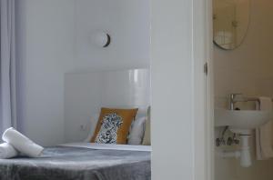 Posteľ alebo postele v izbe v ubytovaní Hostal Argo