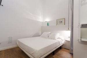 Posteľ alebo postele v izbe v ubytovaní Hostal Argo