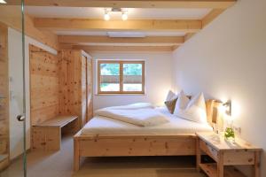 Кровать или кровати в номере UR-NATUR Appartements
