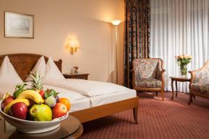 Un pat sau paturi într-o cameră la Hotel City Central
