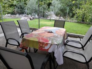 a table and chairs with a table cloth on it at Verde rete apartments2 in Áno Stavrós