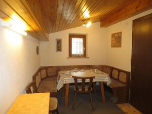 a dining room with a table and chairs at Apartment Mangard - GOP211 by Interhome in Sankt Gallenkirch