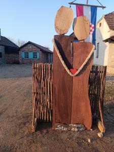 a large brown boot with a hat on it at studio apartman Ervi in Hlebine