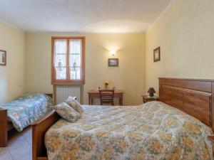A bed or beds in a room at Apartment Daniele by Interhome