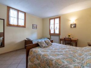 A bed or beds in a room at Apartment Daniele by Interhome