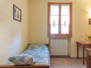 A bed or beds in a room at Apartment Daniele by Interhome