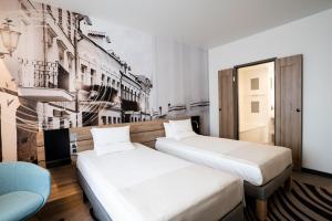 Postel nebo postele na pokoji v ubytování Novotel Vilnius Centre
