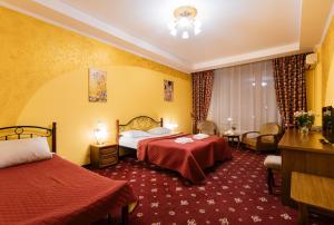 Postel nebo postele na pokoji v ubytování Tiso Apart Hotel + 18 fotografií