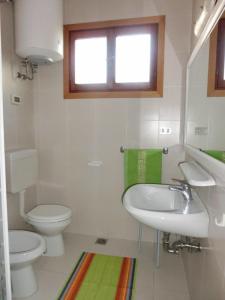 A bathroom at Villa with garden parking and AC