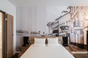 Postel nebo postele na pokoji v ubytování Novotel Vilnius Centre