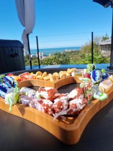 a table with a tray of candies and other snacks at Annas Glamping in Batumi